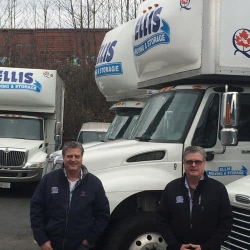 Ellis Moving & Storage trucks with two employees.