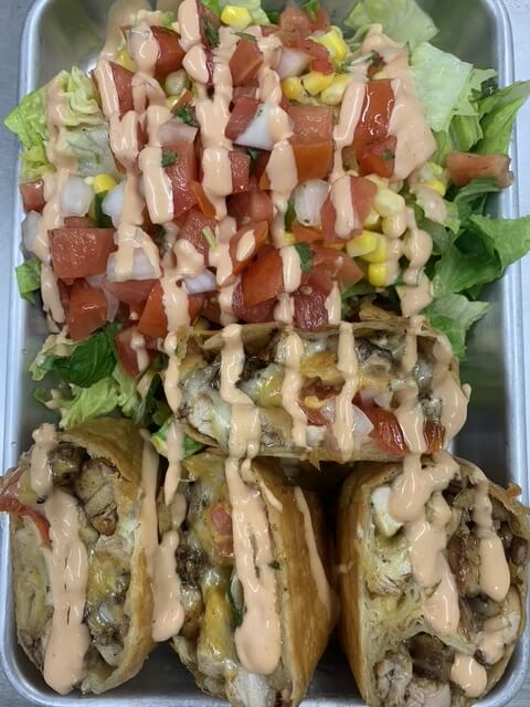 taco salad and burrito on a plate