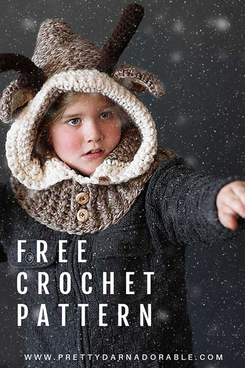 boy wearing crochet reindeer cowl in beige with cream trim and brown antlers.