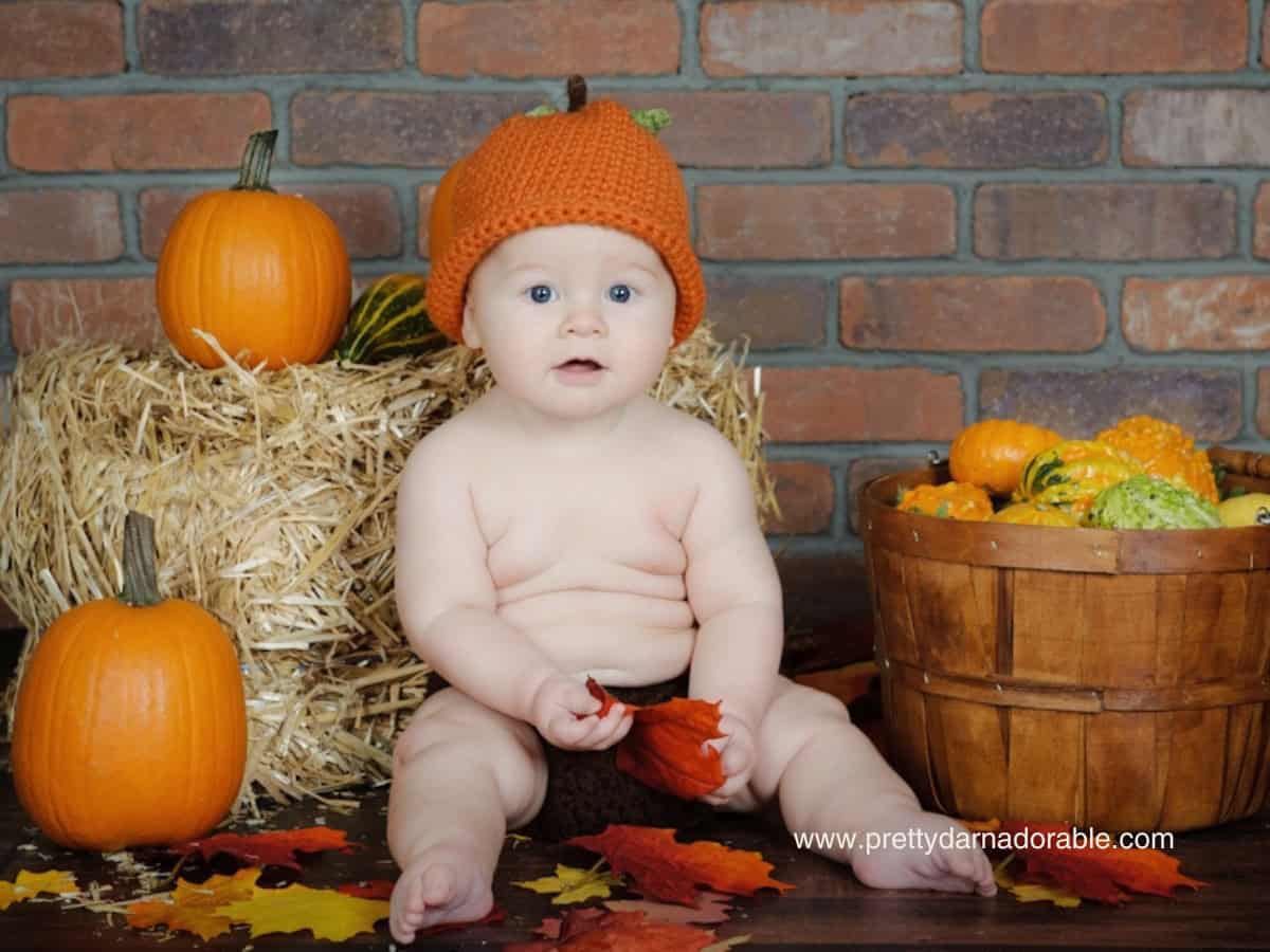 baby wearing crochet pumpkin . Free crochet pumpkin hat pattern and video