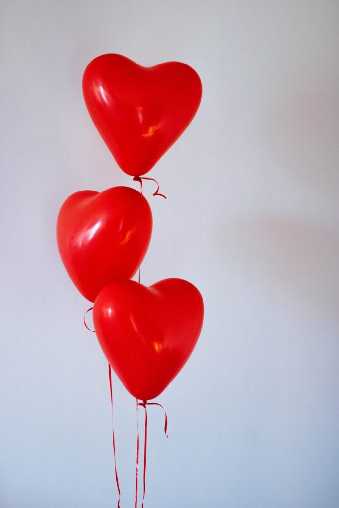 three red heart balloons as a symbol for Valentine's Boudoir and empowerment.