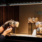 A man standing in front of a mirror posing for the camera