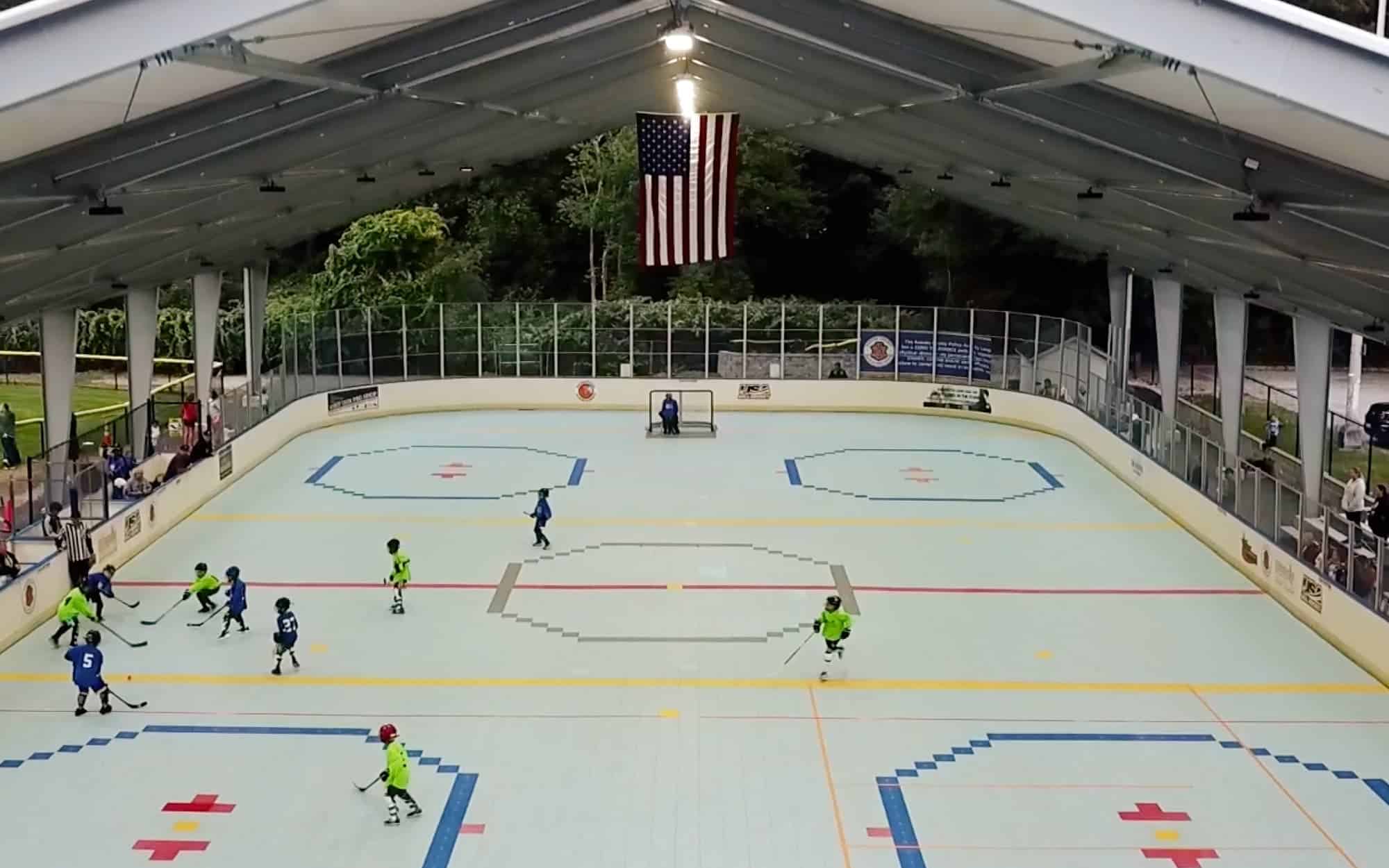 A drone photo shows children playing deck hockey at Dek Superstars.