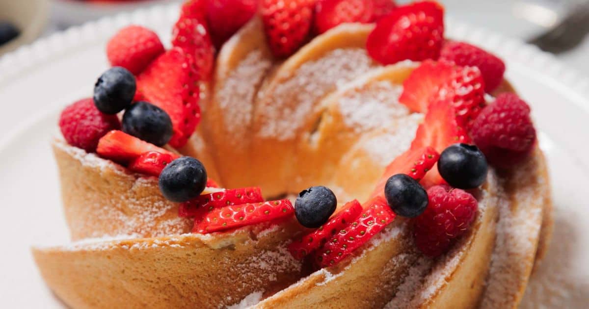 Get ready to fall in love with this gluten-free angel food cake! Light, fluffy, and finished with berries and whipped cream for the ultimate treat.