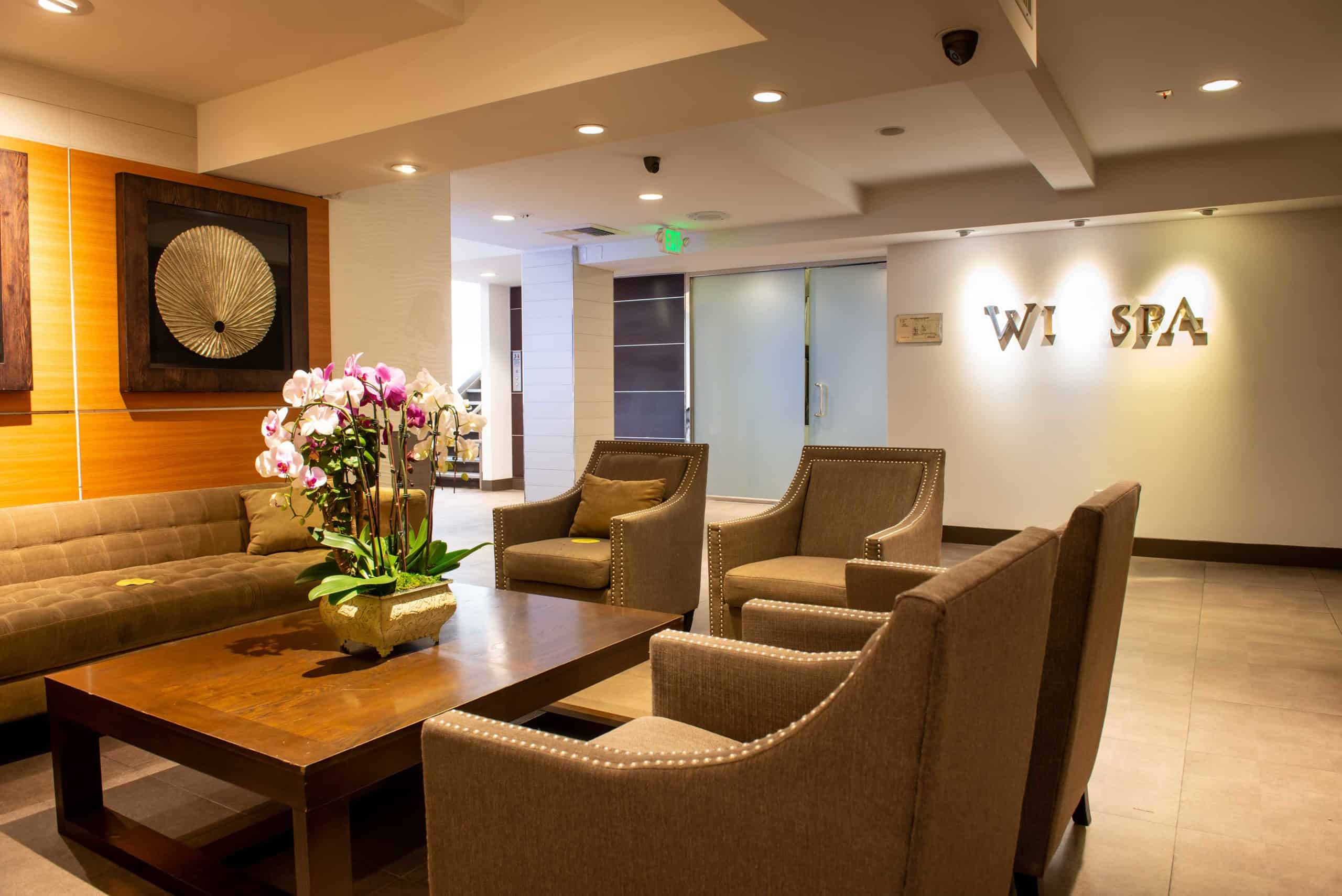 A Korean spa featured in exposure case, with chairs and reception space visible