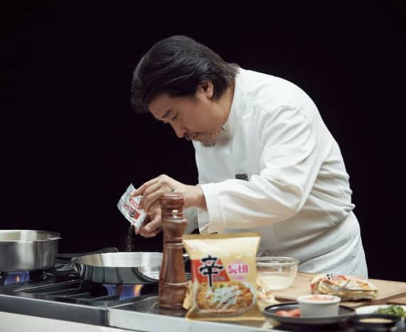 Chef Edward Lee crafting a Shin Ramyun Tumba dish.